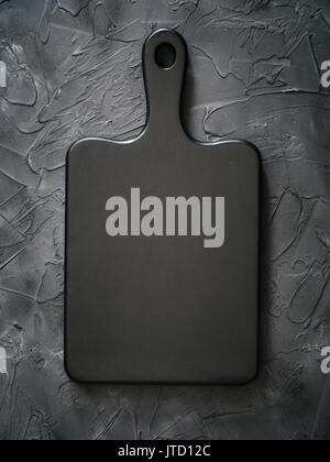 black wooden cutting board on black background Stock Photo