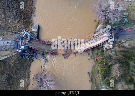 Historic Suspension Bridge over Taieri River, Sutton, Otago, South Island, New Zealand (destroyed in 2017 flood) - drone aerial Stock Photo
