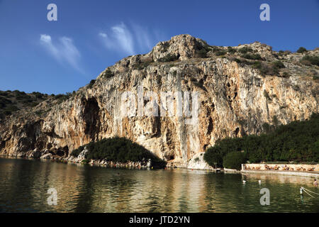 Vouliagmeni Athens Greece Tourists Swimming in Lake Vouliagmeni a Natural Spa - Was Once a Cavern But the Cave Roof Fell in Caused by Erosion from the Stock Photo