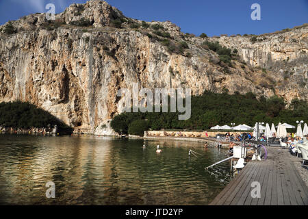 Vouliagmeni Athens Greece Tourists Swimming in Lake Vouliagmeni a Natural Spa - Was Once a Cavern But the Cave Roof Fell in Caused by Erosion from the Stock Photo