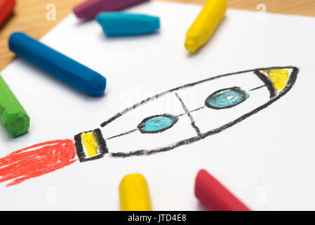 child crayon drawing, rocket , selective focus Stock Photo