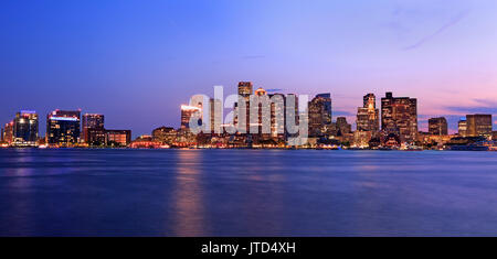 Boston skyline illuminated at night, USA Stock Photo