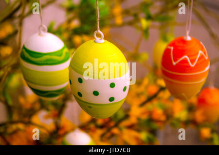 decorated easter eggs hanging from a tree Stock Photo