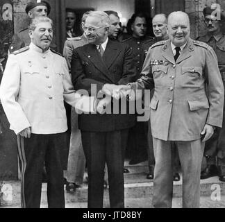POTSDAM CONFERENCE July-August 1945. From left: Joseph Stalin, Harry Truman, Winston Churchill Stock Photo