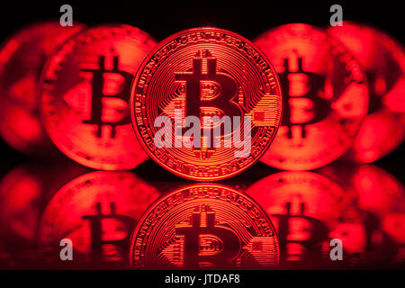 Five Virtual Coins Bitcoins On Printed Circuit Board. Stock Photo