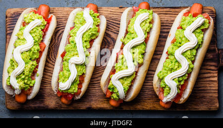 Chilean Completo Italiano. Hot dog sandwich with tomato, avocado and mayonnaise. Top view, copy space Stock Photo