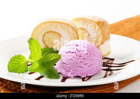 Slices of sponge cake roll with blueberry ice cream Stock Photo