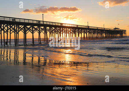 Sunrise at a South Carolina Atlantic coast, Myrtle Beach area, USA. Landscape with the reflection of the sun in shallow water on the foreground and a 