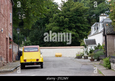 Scotland, Highlands, Town of Cromarty, Scottish Scenery, Housing, Exterior, Greenery, Classic Car, Walkway, Property, Soft Top Yellow Beetle Car Stock Photo