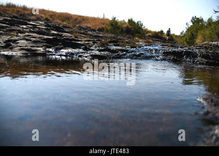 Walking away from Mac Mac Pools in South Africa Stock Photo