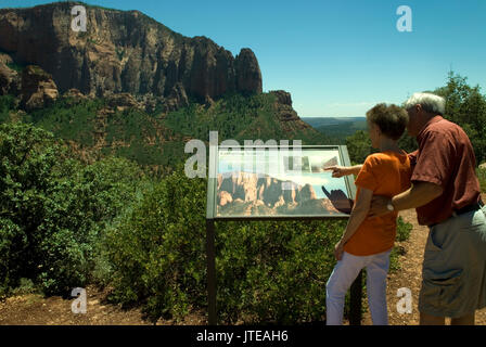 Caucasian Senior Couple (age 60-70)  reading information board at Kolob Canyons at Zion National Park Springdale, Utah USA.. Stock Photo