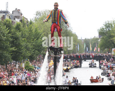 Revelers on the boat in the Prinsengracht canal participating in the Amsterdam Canal Parade during Amsterdam Gay Pride on August 5 , 2017 in Amsterdam Stock Photo