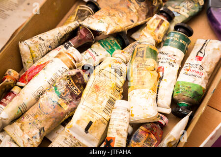 Box of old tubes of oil paint in an artist's studio Stock Photo