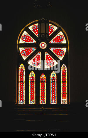 Stained glass windows in the United Methodist Church in Fort Deposit, Alabama, USA. It was built in1899. Stock Photo