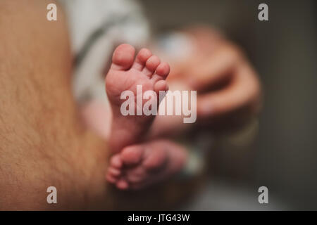 happy father with cute baby feets Stock Photo