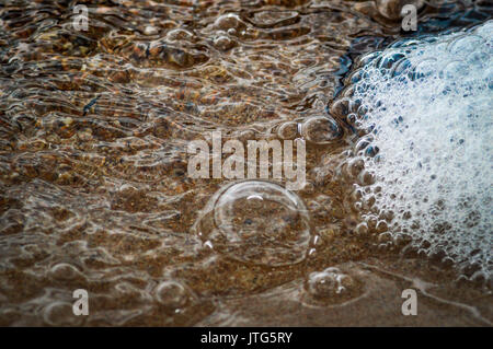 bubbles and foam on waters surface Stock Photo