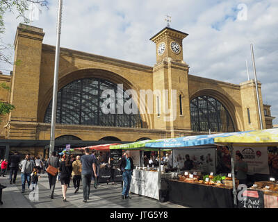View of The Real Food Market on Kings Cross Square in front of the King’s Cross station in London Stock Photo