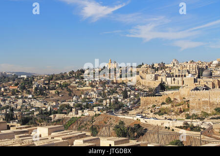 Dormition Abby, St. Peter in Gallicantu and al-Aqsa Mosque in a panoramic view of Jerusalem from a cemetery on the Mount of Olives in Israel beside th Stock Photo