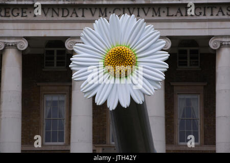 London, UK. 08th Aug, 2017. People Power: Fighting for Peace exhibition. Imperial War Museum, London, UK 8th August 2017 Two large-scale flowers will be will be temporarily placed on the 15-inch naval guns positioned in front of IWM London. Flowers were chosen as they have been a significant part of the peace movement, from the white poppy worn as a symbol of peace to the iconic image of a protester placing flowers in the barrels of rifles held by US military police at a demonstration against the Vietnam War in 1967. Credit: Jeff Gilbert/Alamy Live News Stock Photo