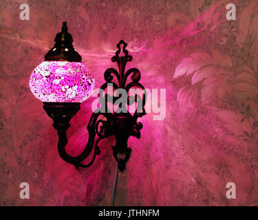 Turkish handmade pink lamp on the wall Stock Photo