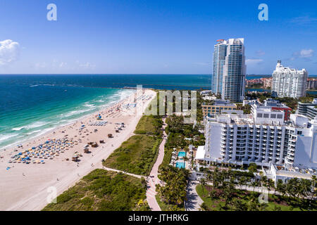 Miami Beach Florida,aerial overhead from above view,above,from above view,Atlantic Ocean,sand,sunbathers,residential condominium buildings,Continuum,F Stock Photo