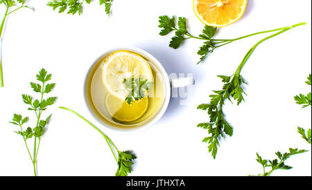 Parsley tea with lemon and lime slices on white Stock Photo