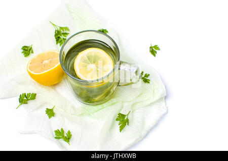 Parsley tea with lemon and lime slices on white Stock Photo