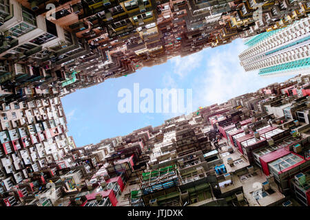 Bottoms up view of over-crowded housing in Hong Kong's old residential district of Quarry Bay. With a population of over 7 million, Hong Kong is one o Stock Photo
