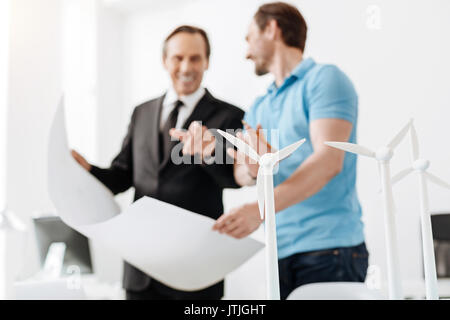 Two engineers discussing a new power station project Stock Photo