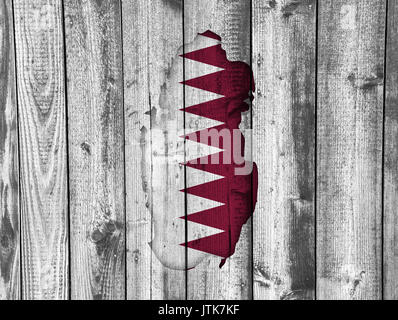 Map and flag of Qatar on weathered wood Stock Photo