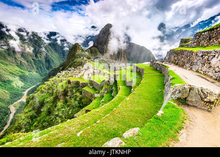 Machu Picchu, Peru - Ruins of Inca Empire city and Huaynapicchu Mountain, Sacred Valley, Cusco. Amazing place of South America. Stock Photo