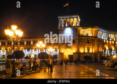 Yerevan, Armenia. September 10, 2016: Local residents and tourists are walking along the street of Yerevan against The Government of the Republic of A Stock Photo