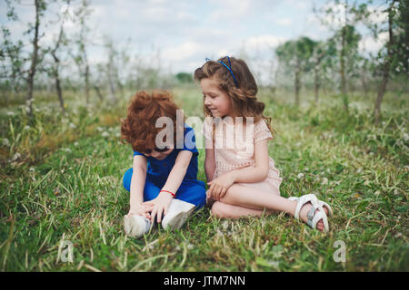 cute stylish children in summer park Stock Photo