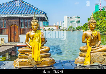 The scenic Seema Malaka Temple on Beira lake is surrounded by modern quarters with active construction, busy streets and heavy traffic, Colombo, Sri L Stock Photo