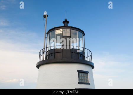 Small Castle Hill lighthouse in Newport, Rhode Island overlooking the Atlantic Ocean, built in 1830 Stock Photo