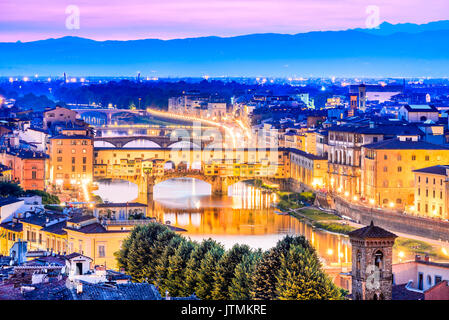 Florence, Tuscany - Ponte Vecchio and Palazzo Vecchio at night, Renaissance architecture in Italy. Stock Photo