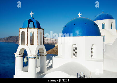 Blue domes in Oia or Ia, a small town and former community in the South Aegean on the islands of Thira and Therasia, in the Cyclades, Greece Stock Photo