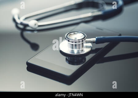 mobile phone diagnostics and repair service. smartphone with stethoscope Stock Photo