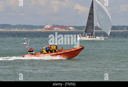 an RNLI royal national lifeboat institution rib off of Cowes on the isle of wight during cowes week annual yachting regatta. saving lives at sea. Stock Photo