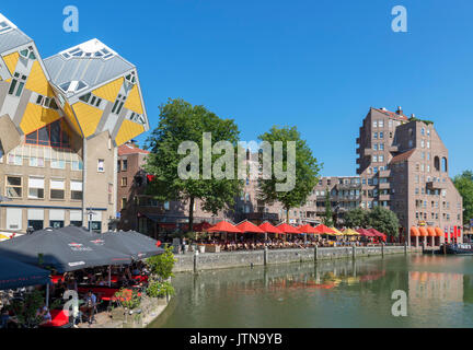 Waterfront restaurants in the Oude Haven (Old Harbour) with Cube Houses (Kubuswoningen) to the left, Rotterdam, Netherlands Stock Photo