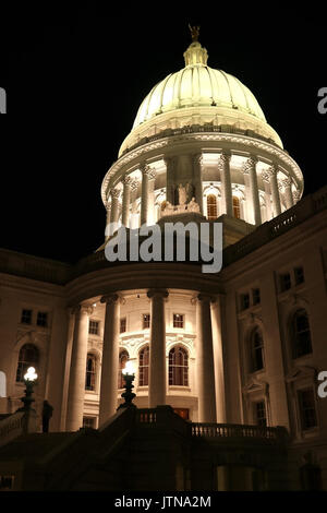 Wisconsin State Capitol building in Madison entrance and dome illuminated in the dark. Night scene, close up vertical composition. Stock Photo
