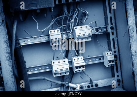Save electricity sign on old electrical power wiring box in abandoned hospital Stock Photo