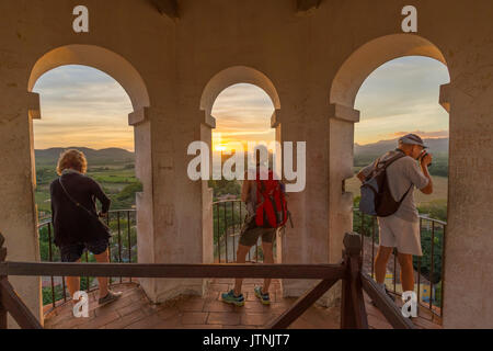 Three Toursits enjoy the view of Valle do los Ingenios from lookout tower Stock Photo