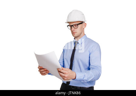 Construction engineer looking at the blueprint. Isolated on white. Stock Photo