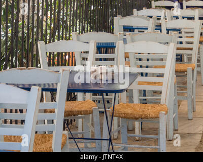 Athens, Greece - April 03, 2015: Empty cafe tables on a sunny morning in Athens. Stock Photo