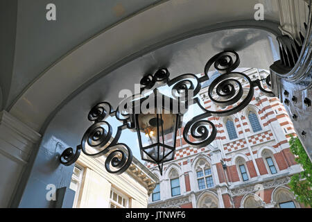 Gas Lamp lantern in archway entrance to New Square near Carey Street in Lincolns Inn, Holborn London England UK  KATHY DEWITT Stock Photo