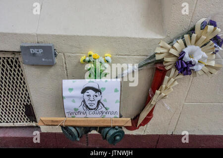 memorial tribute to black victim of hate crime include superb ink portrait of his bleak face fastened to standpipe on 36th Street NYC Garment district Stock Photo