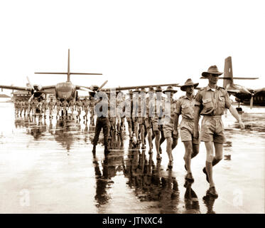 A contingent of the Royal Australian Air Force arrives at Tan Son Nhut Airport, Saigon, to work with the South Vietnamese and U.S. Air Forces in transporting soldiers and supplies to combat areas in South Viet-nam.  August 10, 1964.  Army NARA FILE #:  306-PSC-64-5382 WAR & CONFLICT BOOK #:  393 Stock Photo