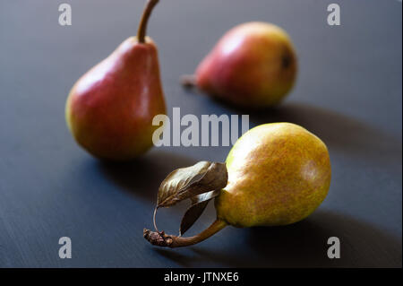 Three ripe juicy pears on a background Stock Photo