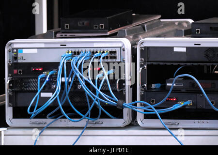 Bunch of cables inside network router connection Stock Photo